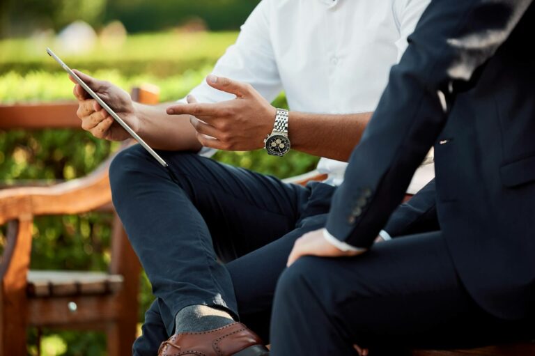 A financial advisor pointing at a digital dashboard on a tablet during a consultation, representing professional wealth planning for ADF veterans.